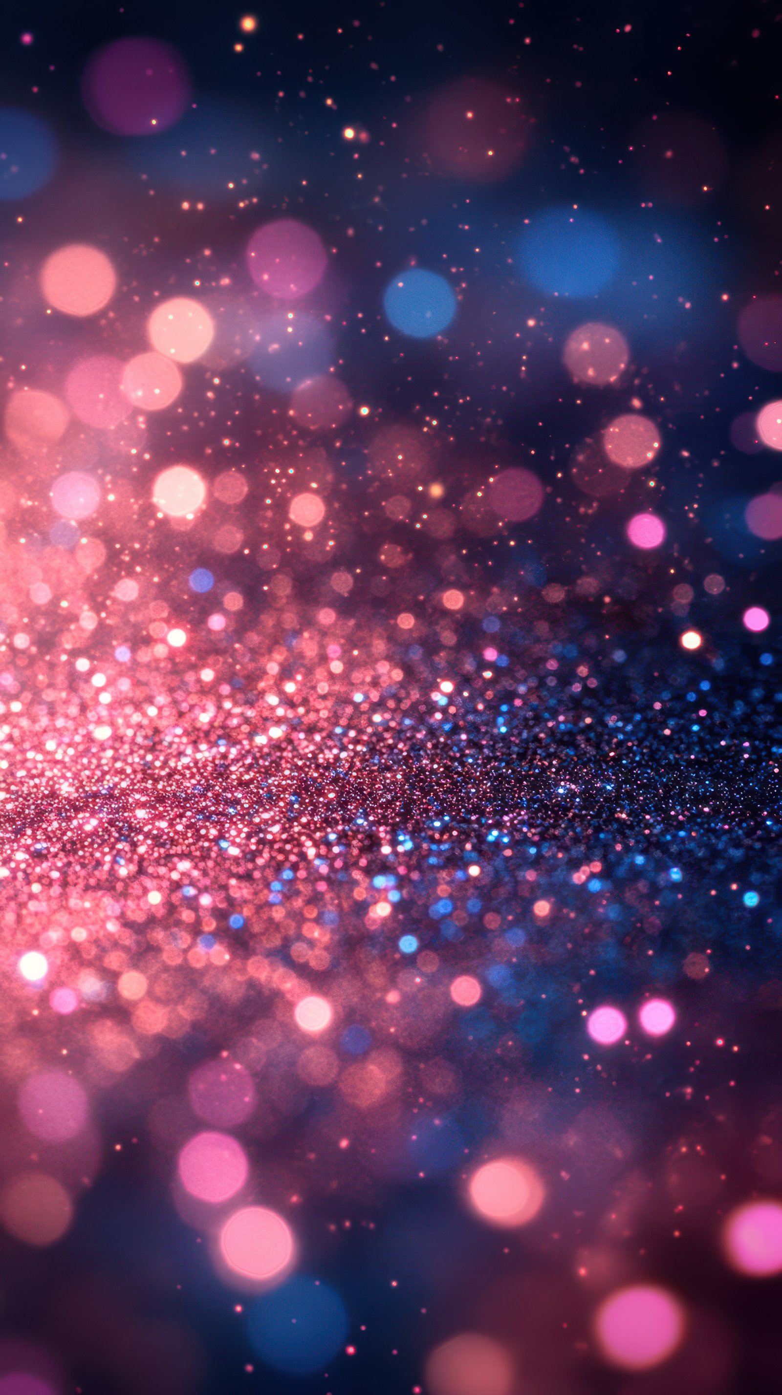 Colorful bokeh effect with pink and blue lights creating a dreamy abstract atmosphere at night